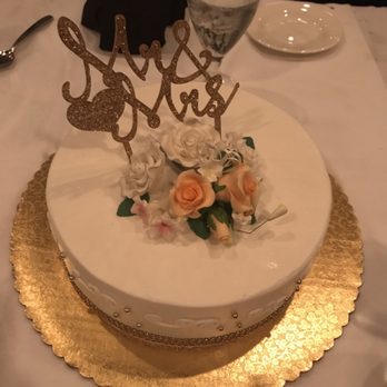 Celebrity Cakes - a wedding cake with a crown on top - Custom Cakes Near Me - Tamarac, Florida