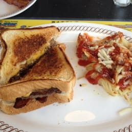 Beef patty melt with bacon and has browns Beef patty melt with bacon and has browns