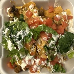 Cajun Chips, Queso, beef, tomato's, white rice, lettuce, sour cream.