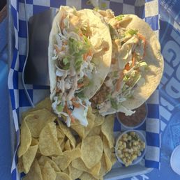 Salmon teriyaki taco with nachos salsa and spicy corn