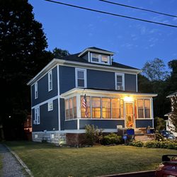 Red Cedar Roofing and Siding - Transformed an early 1900's home to a contemporary style with this new vinyl siding replacement and trim accents!