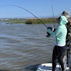 Wombat Charters - Bob coaching Danielle on how to properly reel in a fish