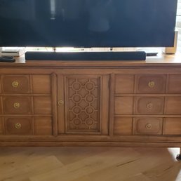I love this cabinet.  High end piece by Tamerlane.  The craftsman and details are nice transitional mid century that is timeless.