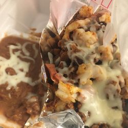 Los Charros Mexican Restaurant - Discada with shrimp, beef and hot dogs. Came with refried beans. Was supposed to have tortillas but he forgot them..
