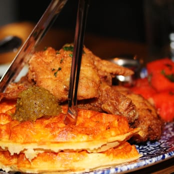 Yardbird - Chicken n' Watermelon n' Waffles ($36): Honey Hot Sauce, Chilled Spiced Watermelon, Cheddar Cheese Waffle & Bourbon Syrup - Southern Near Me - Las Vegas, Nevada