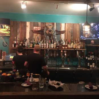 Flying Pig Pub & Kitchen - A Flying pig above the bar. - Pubs Near Me - Oceanside, California