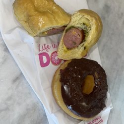 Clear Falls Donuts - Large sausage cheese & jalapeño kolache. Chocolate glazed donut.