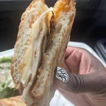 Cafe Zeb - a person holding a sandwich in their hand - Breakfast & Brunch Near Me - Berkeley, California