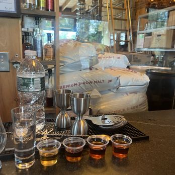 Watercure Farm - Flight of the brandy, Rye whiskey, barley bourbon, and wheated bourbon. - Distilleries Near Me - Pomfret Center, Connecticut