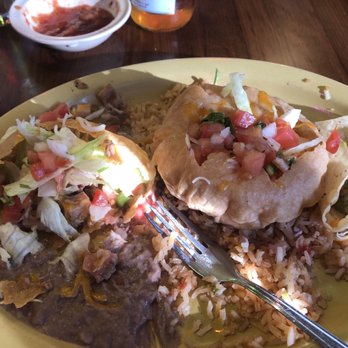 Queso Mexican Restaurant - Two "puff" tacos, rice and beans under them. - Mexican Near Me - Baton Rouge, Louisiana