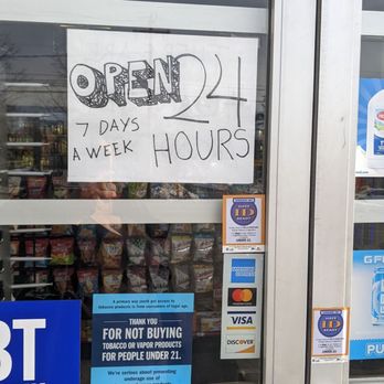 Pit Stop Gas - a sign in the window of a store - Convenience Stores Near Me - Torrington, Connecticut