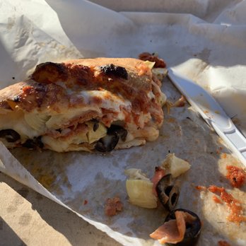 SLICED - Cheese Calzone w/ pep, olives, artichokes 3/4 eaten! - Pizza Near Me - Bakersfield, California