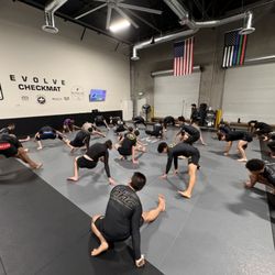 Evolve Checkmat Jiu Jitsu / Muay Thai Academy - Making sure to stretch to avoid injuries.