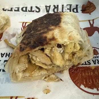 Petra Street - One piece of the chicken shawarma sandwich - Mediterranean Near Me - Naperville, Illinois Petra Street - One piece of the chicken shawarma sandwich - Mediterranean Near Me - Naperville, Illinois