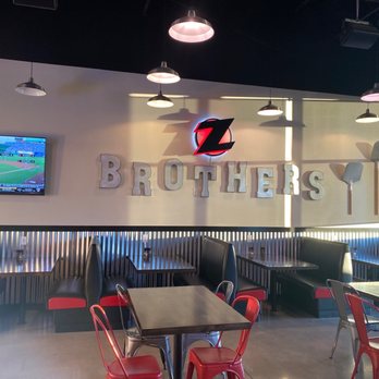 Z Brothers Pizza - Tables and chairs from the cash register in the lobby - Pizza Near Me - Layton, Utah Z Brothers Pizza - Tables and chairs from the cash register in the lobby - Pizza Near Me - Layton, Utah
