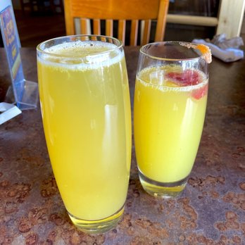 Henhouse Cafe - Wow-Mosa (Four Peaks WOW beer mimosa) (L) and a Pineapple Orange Strawberry Mimosa (R) - American Near Me - Mesa, Arizona