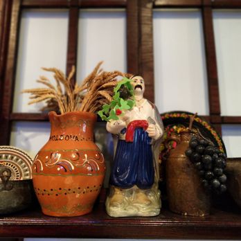 Moldova Restaurant - ceramic figurines on a shelf - Modern European Near Me - Brooklyn, New York Moldova Restaurant - ceramic figurines on a shelf - Modern European Near Me - Brooklyn, New York