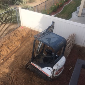 Rafael's Landscape - Using the Bobcat Mini Excavator for demo and digging trenches. - Landscaping Near Me - Rialto, California