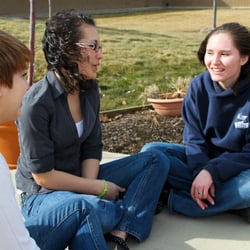 Elevations RTC - Students reaching out to each other.