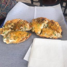 Tuna melt on onion bagel.