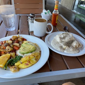 Red Rock Cafe - Three egg omelette with bacon tomato and avocado and home fries and biscuit and gravy with extra pepper - Breakfast & Brunch Near Me - Sedona, Arizona
