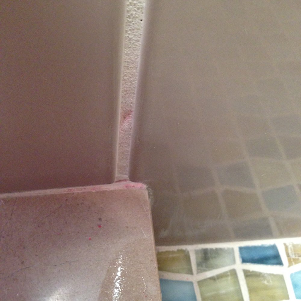 Second Generation Tile & Stone - Indentations throughout and discoloration (see the orange) - Tiling Near Me - Petaluma, California