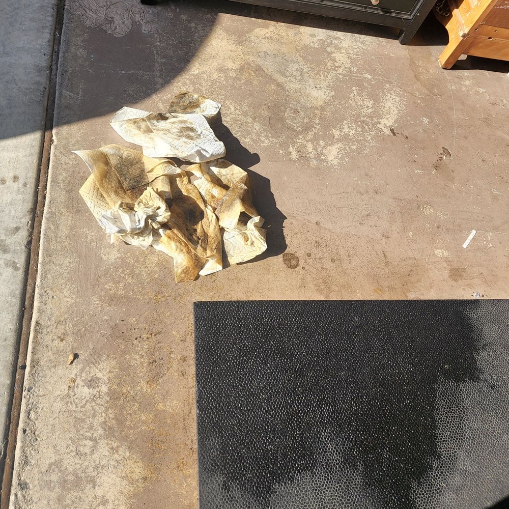 Meineke Car Care Center - Clean up of all the oil. Stall mats are ruined and oil is filled underneath the mats. - Auto Repair Near Me - Fallbrook, California Meineke Car Care Center - Clean up of all the oil. Stall mats are ruined and oil is filled underneath the mats. - Auto Repair Near Me - Fallbrook, California