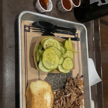 Regal Eagle Smokehouse: Craft Drafts & Barbecue - Pork butt platter with a side of house made pickles. - Barbeque Near Me - Lake Buena Vista, Florida Regal Eagle Smokehouse: Craft Drafts & Barbecue - Pork butt platter with a side of house made pickles. - Barbeque Near Me - Lake Buena Vista, Florida