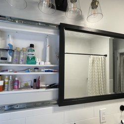Carpet & Tile Mart - Custom vanity with hidden outlet to charge electric tooth brushes. They are finally hidden away!