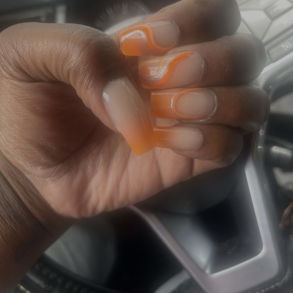 Orange/nude ombré - medium length with freestyle nail art. Orange/nude ombré - medium length with freestyle nail art.