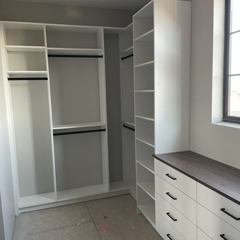 Closet Factory - Walk in closet in white melamine with Luxent countertop and matte black handles and rods. - Interior Design Near Me - hurricane, Utah Closet Factory - Walk in closet in white melamine with Luxent countertop and matte black handles and rods. - Interior Design Near Me - hurricane, Utah