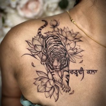 Ink Therapy Studio - Tiger, lotus, Hindi tattoo by Charlotparis inks - Tattoo Near Me