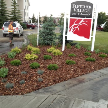 Koverall Industries ltd - a sign in front of a building - Landscaping Near Me Koverall Industries ltd - a sign in front of a building - Landscaping Near Me