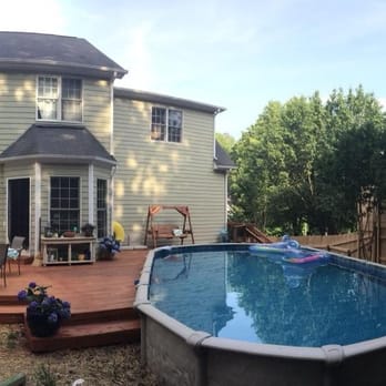 Decks By All Means - A panorama of the backyard with the deck and pool - Decks & Railing Near Me - Cary, North Carolina