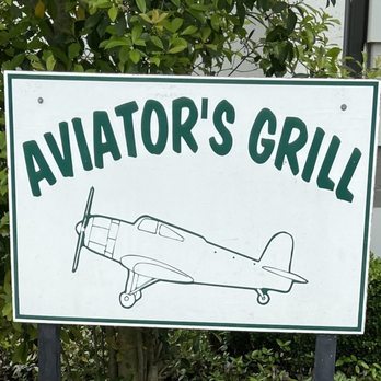 Aviator's Grill - an airplane drawn on a sign - American Near Me - Spring, Texas