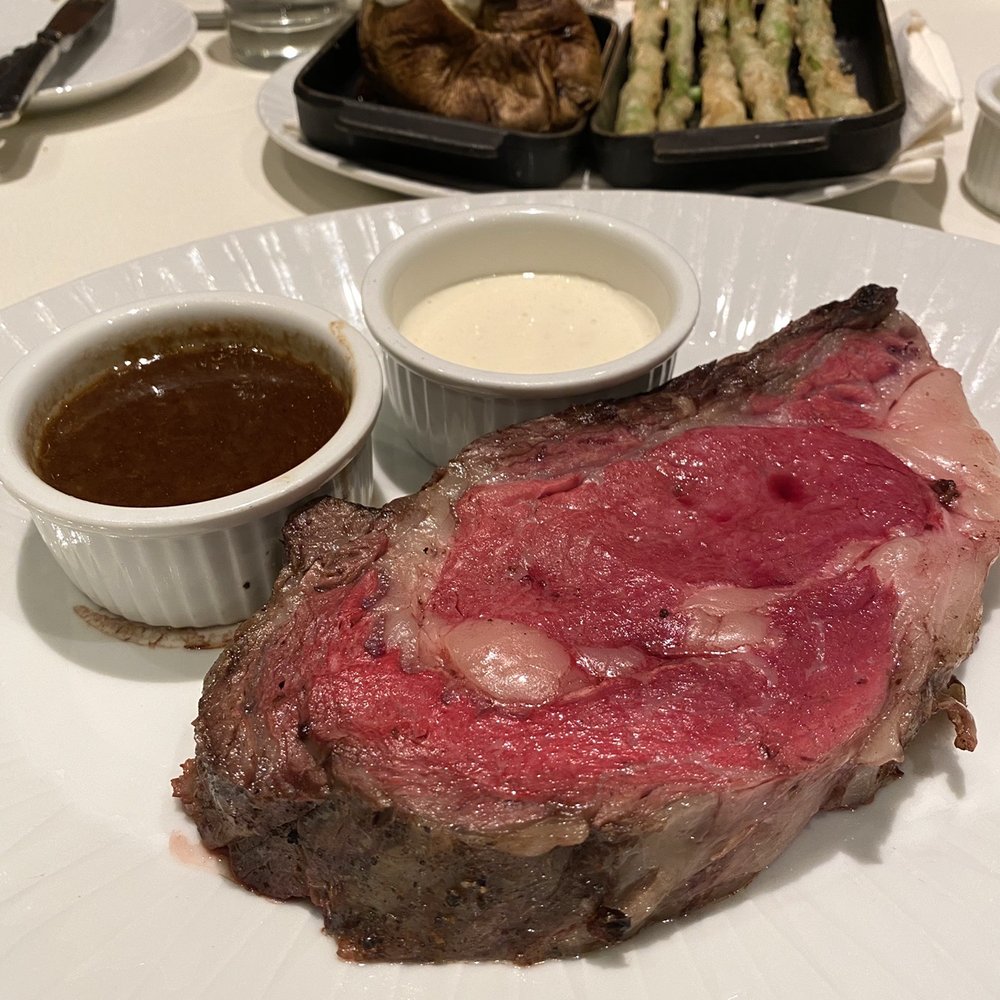 Henry's Steakhouse - Prime rib with choice of two sides - loaded baked potato and tempura asparagus - Steakhouses Near Me - Placerville, California