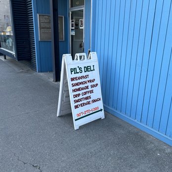 Pil's Deli - Sign outside on the sidewalk - Delis Near Me - Anchorage, Alaska