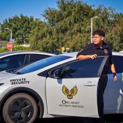 Owl Sight Security Services - security guard exiting security patrol vehicle