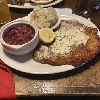 Cafe Rustika - Pork Schnitzel with Lemon cream sauce, red cabbage, and potato salad. - German Near Me - Richmond, Virginia Cafe Rustika - Pork Schnitzel with Lemon cream sauce, red cabbage, and potato salad. - German Near Me - Richmond, Virginia