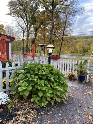 Photo of Francisco's On The River - Washington Crossing, PA, US. a white picketed fence and a garden