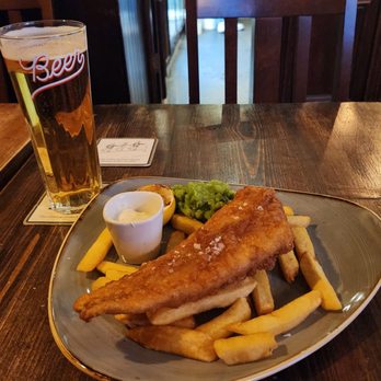 The Old Buttermarket - Standard portion haddock & chips. Fish was fresh, flakey and battered just enough to make it crispy. - Pubs Near Me - Canterbury, KEN The Old Buttermarket - Standard portion haddock & chips. Fish was fresh, flakey and battered just enough to make it crispy. - Pubs Near Me - Canterbury, KEN