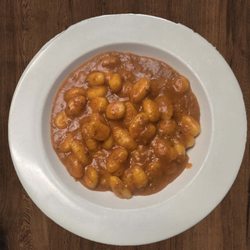 Potato Gnocchi - Mushrooms, cherry tomatoes, bolognese sauce, topped with fresh mozzarella.