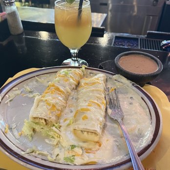 El Molinito - Enchiladas de La Casa Plate rolled chicken taquitos  servers with a white sauce with Frijoles! - Mexican Near Me - Oro Valley, Arizona