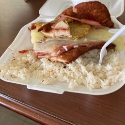 a plate of food with rice and meat a plate of food with rice and meat