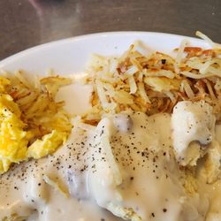 Crazy Cow Cafe - Biscuits and sausage gravy, hashbrowns, and a sampling of scrambled eggs and cheese.