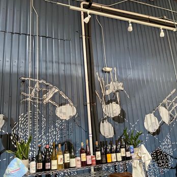 The Austin Winery - bottles of wine on a bar - Wine Tasting Room Near Me - Austin, Texas The Austin Winery - bottles of wine on a bar - Wine Tasting Room Near Me - Austin, Texas