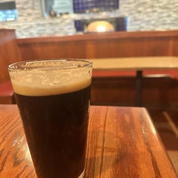Vesta - a glass of beer on a table - New American Near Me - Coralville, Iowa Vesta - a glass of beer on a table - New American Near Me - Coralville, Iowa