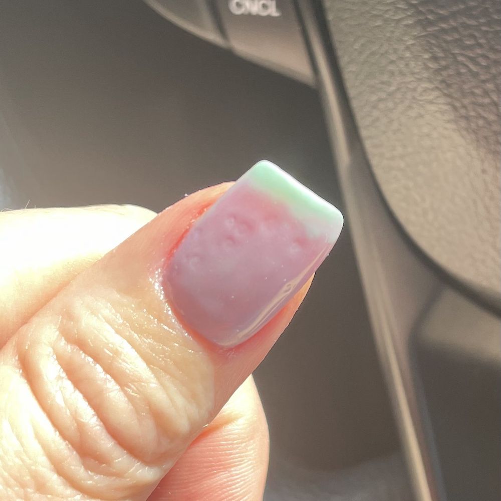 Exotic Nails - Close up of left thumb showing all of the divots. - Nail Salons Near Me - West Covina, California Exotic Nails - Close up of left thumb showing all of the divots. - Nail Salons Near Me - West Covina, California