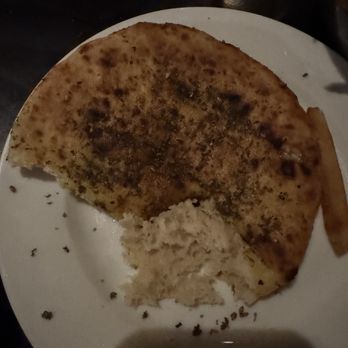 Checker Hall - The seasoned pita bread that is served with the whipped feta! Fluffy, warm and delish!! - Mediterranean Near Me - Los Angeles, California