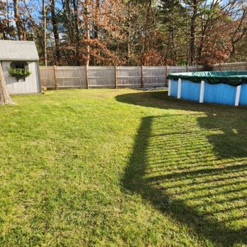 Jvick Lawn Care - a view of a backyard with a pool - Lawn Services Near Me - Fairhaven, Massachusetts